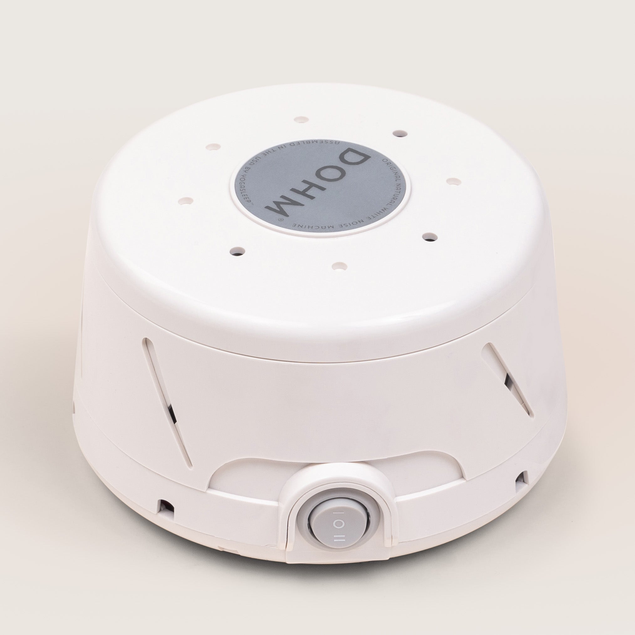 Angled perspective of white Yogasleep Dohm Classic mechanical white noise sound machine