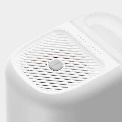 Top view of Canopy large room humidifier in white showing mist-free evaporative fan grill