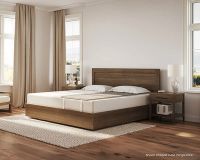 Wooden bed in a bedroom with white bedding and nightstands.