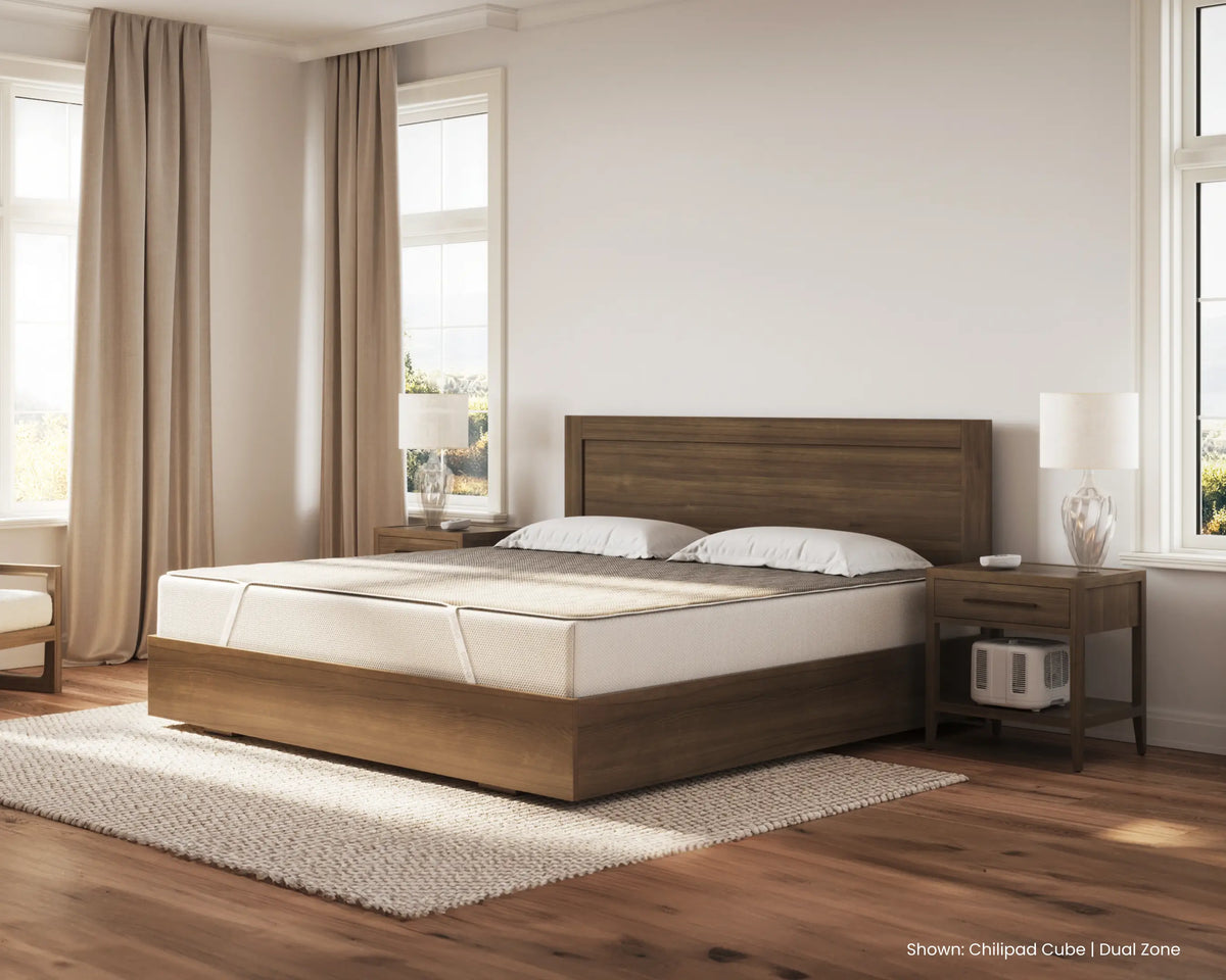 Wooden bed with white bedding in a bedroom setting