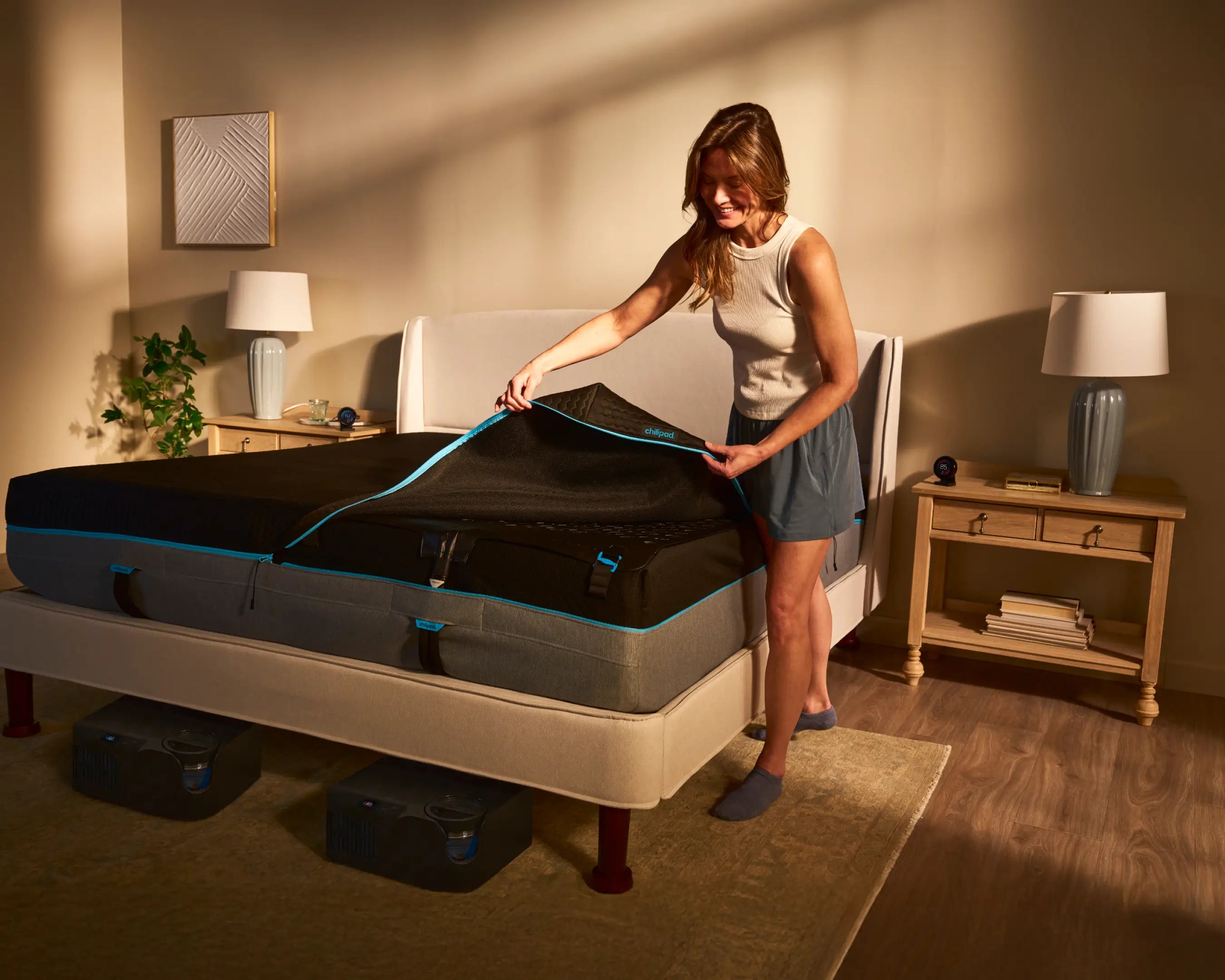 Woman unboxing a new mattress in a bedroom setting