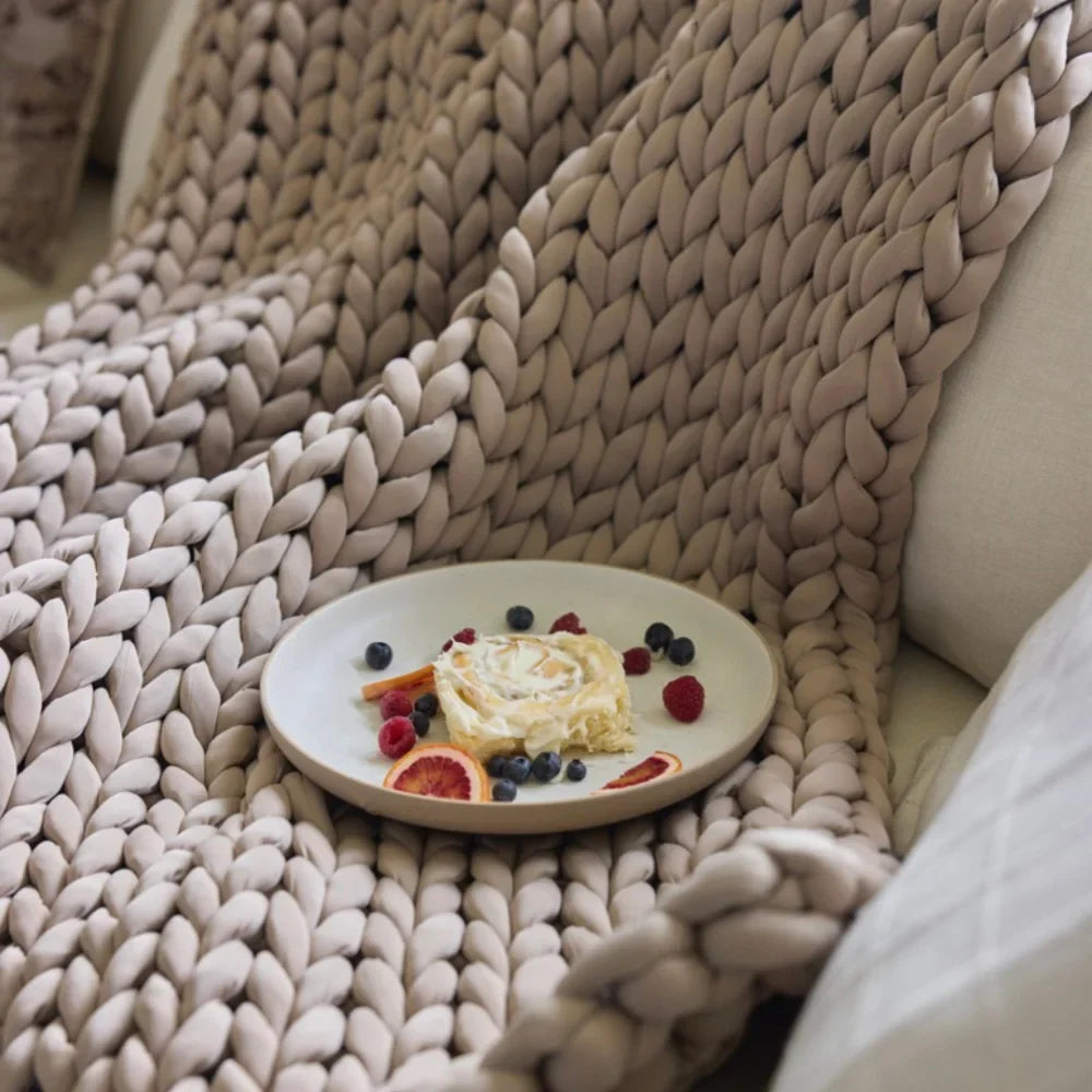 Close-up of open-knit loops on Nuzzie Ice Knit cooling weighted blanket in coastal sand