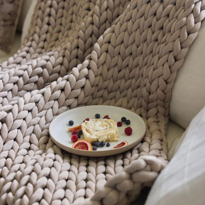 Close-up of open-knit loops on Nuzzie Ice Knit cooling weighted blanket in coastal sand