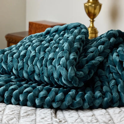 Close-up of plush hand-woven sapphire velvet yarn loops on Nuzzie weighted blanket
