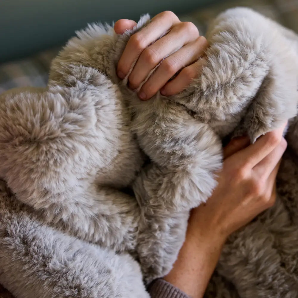 Close-up of plush woven loops on Nuzzie Snuggle Luxe chunky knit blanket in earl grey