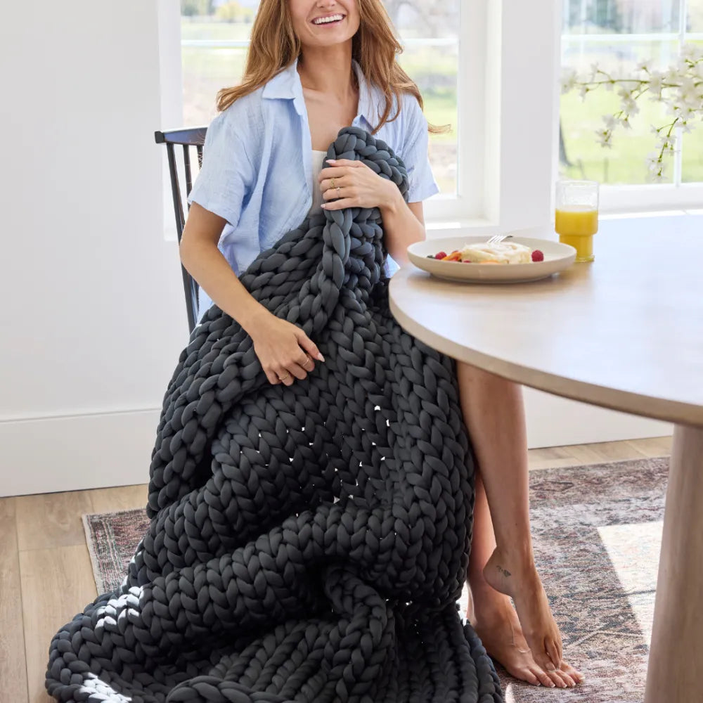 Detailed view of hand-knit bamboo viscose loops on Nuzzie northern grey cooling blanket