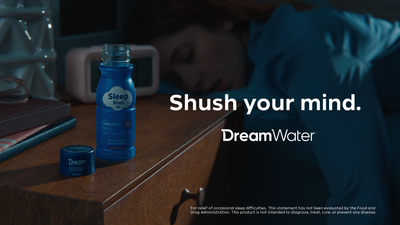DreamWater bottle on a nightstand with text 'Shush your mind.' and 'DreamWater' branding.