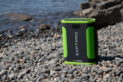 EXP96PRO APEX heavy-duty CPAP battery resting on rocky terrain during outdoor camping
