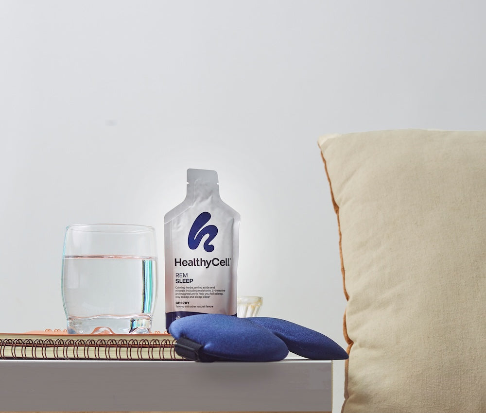 HealthyCell REM Sleep MicroGel single-serve packets resting on bedside nightstand
