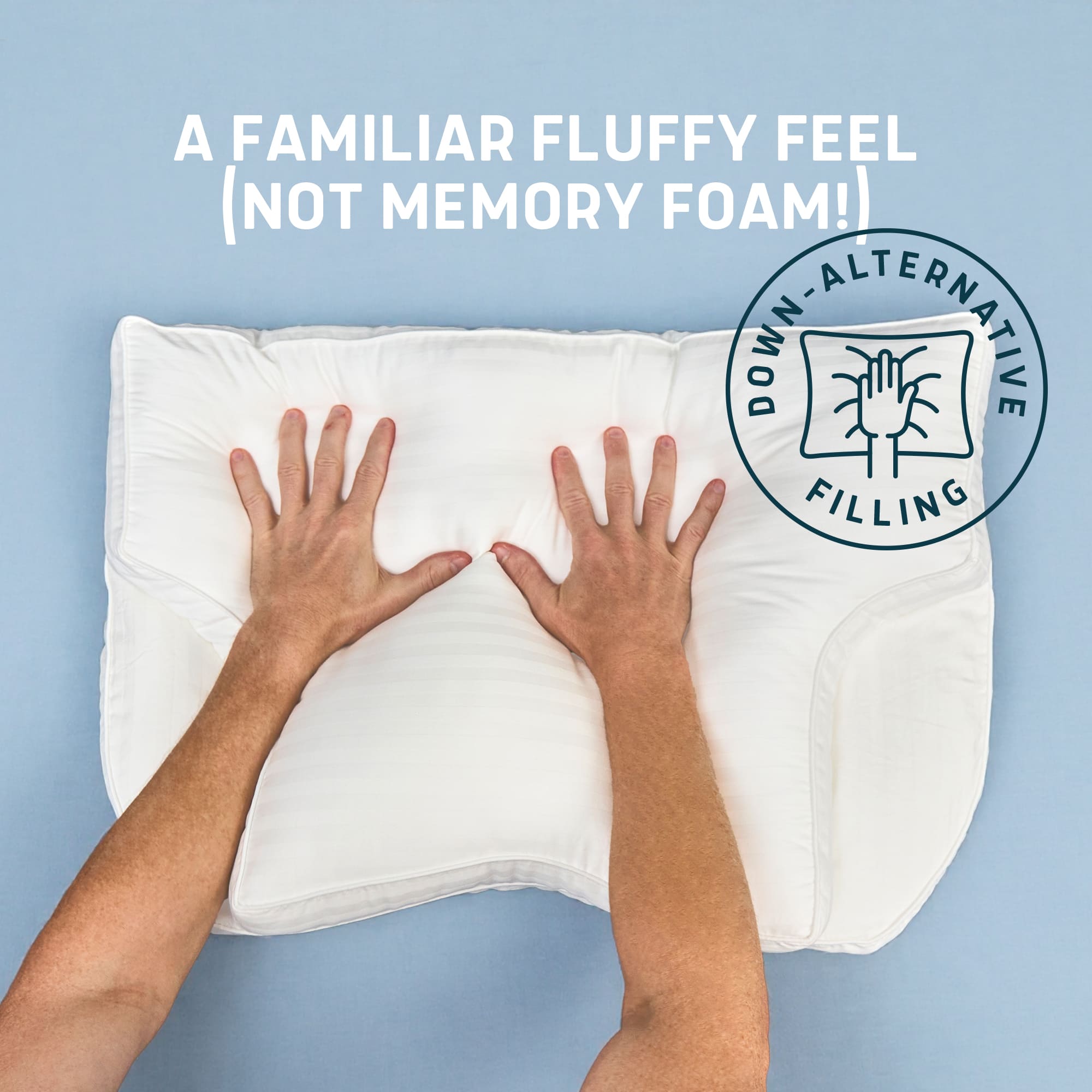 White pillow with hands pressing down on it against a blue background, featuring text about down-alternative filling.