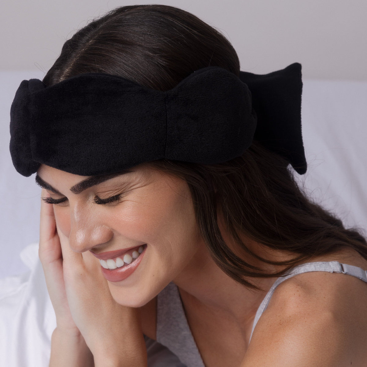 Nodpod weighted sleep mask in Black Onyx, in use for relaxing