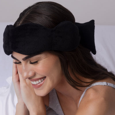 Nodpod weighted sleep mask in Black Onyx, in use for relaxing
