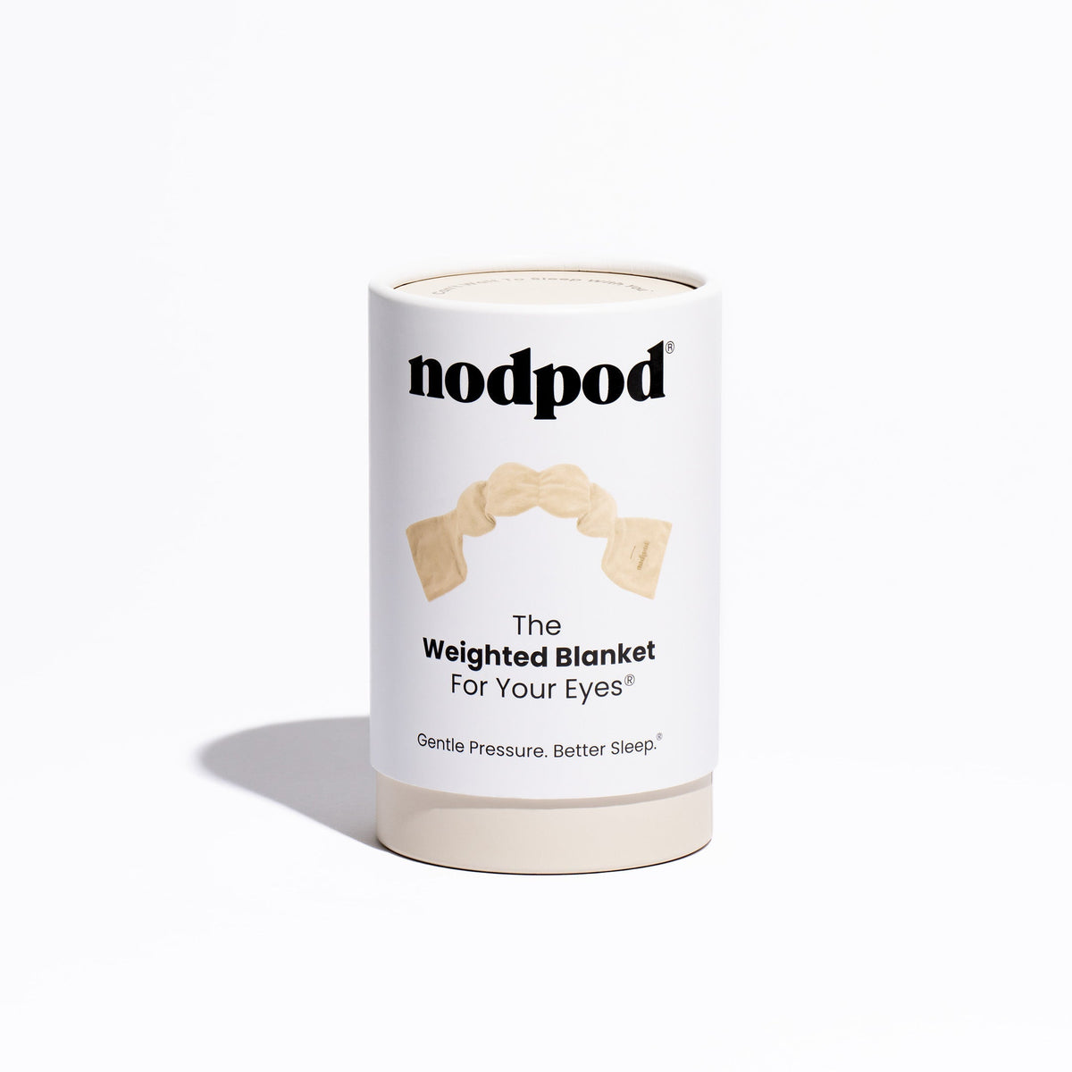 Nodpod original weighted sleep mask in neutral bone color laid flat