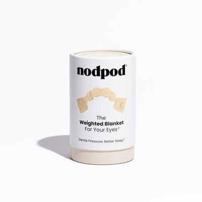 Nodpod original weighted sleep mask in neutral bone color laid flat