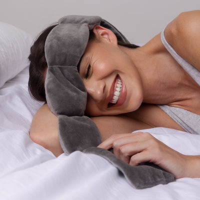 Nodpod weighted sleep mask in Elephant Gray, worn while resting