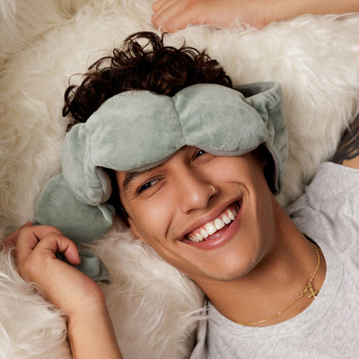 Nodpod weighted sleep mask, with a person waking refreshed