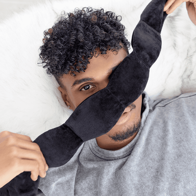 Nodpod weighted sleep mask, worn by a man