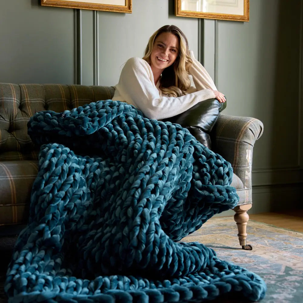 Nuzzie chunky hand-knit velvet weighted blanket in deep sapphire blue color