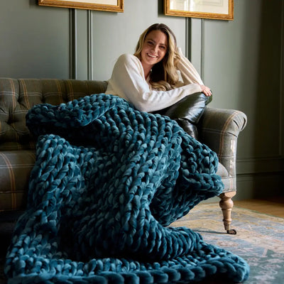 Nuzzie chunky hand-knit velvet weighted blanket in deep sapphire blue color