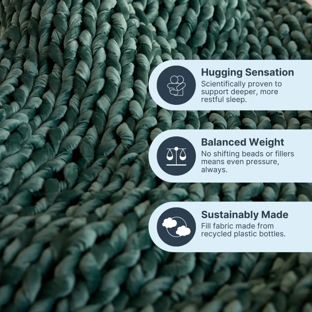 Nuzzie emerald velvet weighted blanket folded elegantly on living room couch
