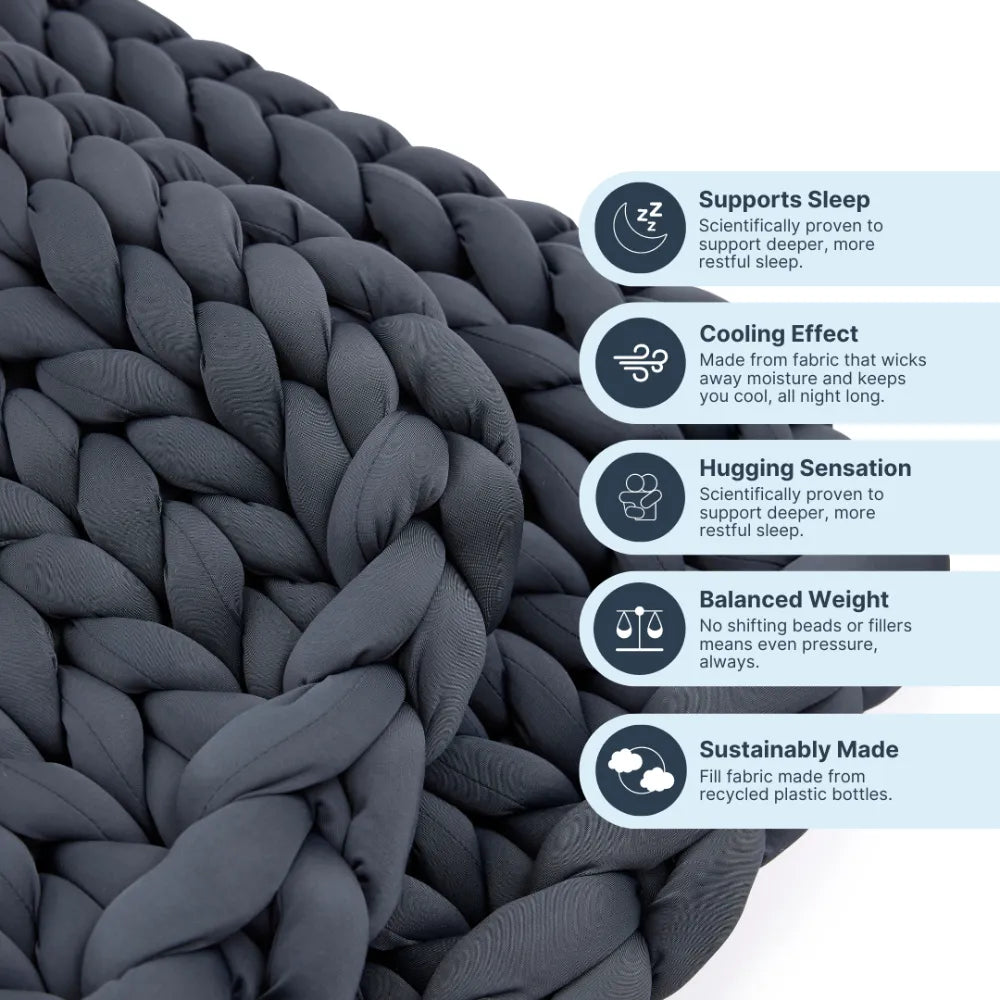 Nuzzie Ice Knit cooling weighted blanket in northern grey draped over armchair