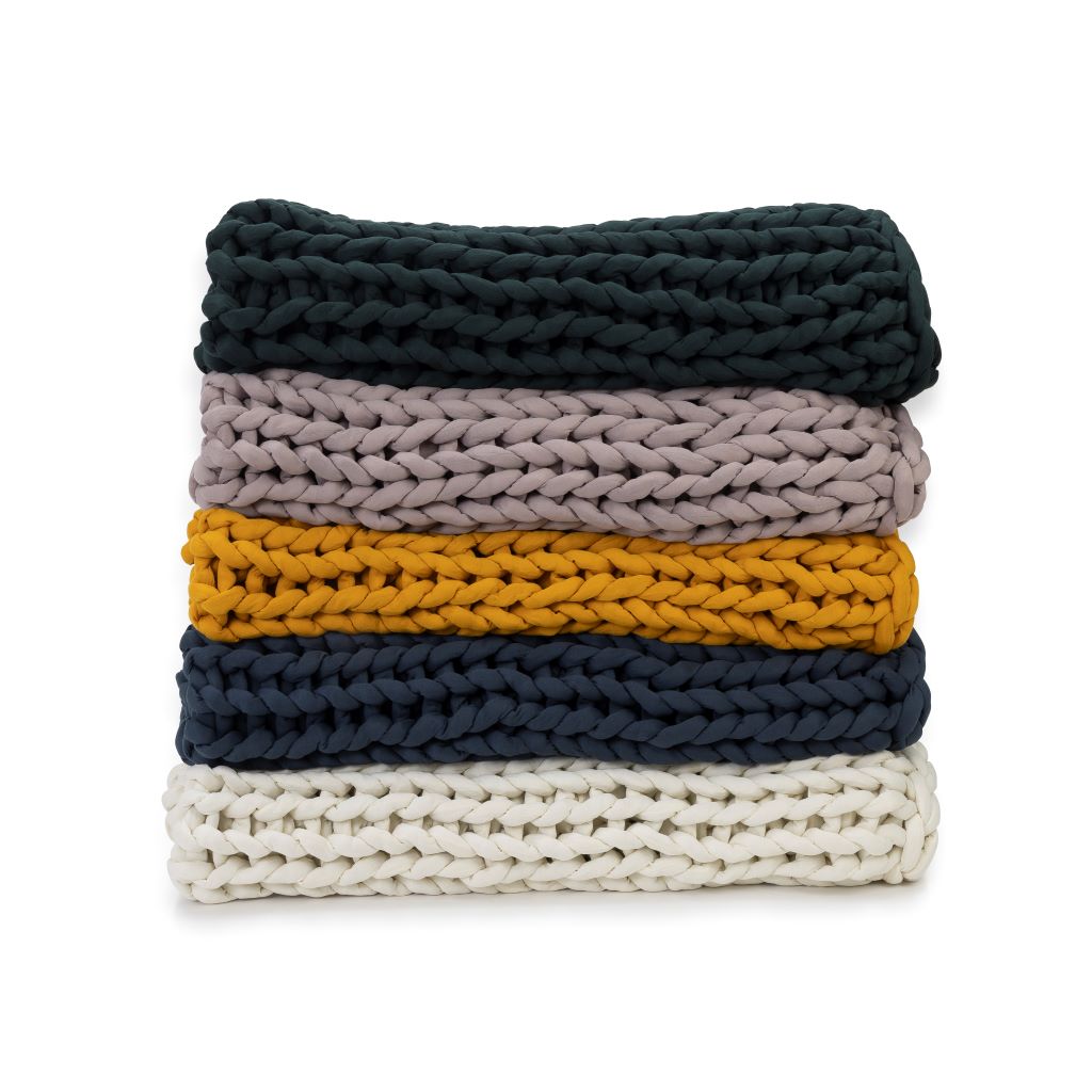 Nuzzie knit weighted blanket, shown in five colors