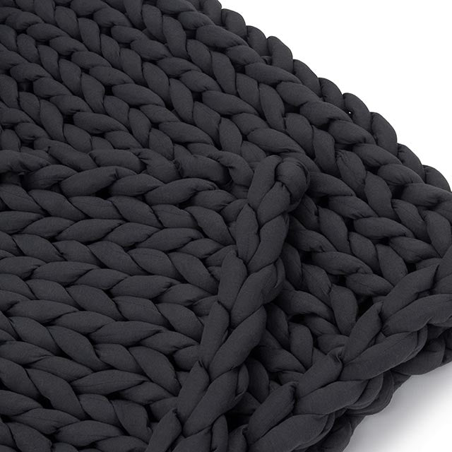 Close-up of thick 100% organic cotton tube yarn knit on Nuzzie charcoal weighted blanket
