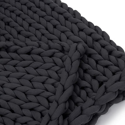 Close-up of thick 100% organic cotton tube yarn knit on Nuzzie charcoal weighted blanket