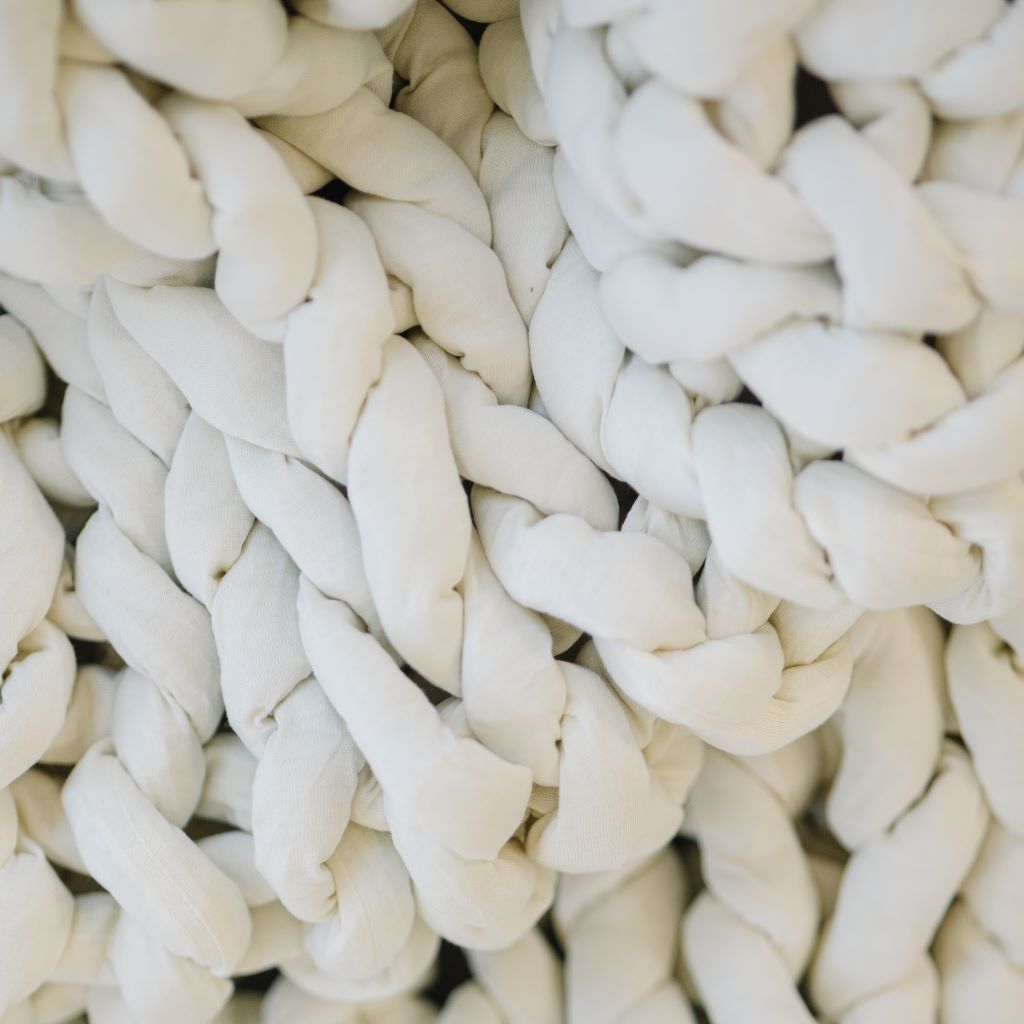 Nuzzie knit weighted blanket in Cream, close-up of the fabric