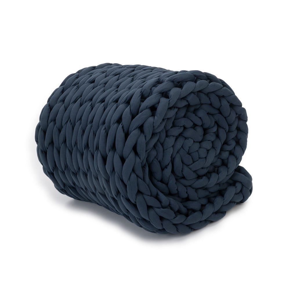 Nuzzie knit weighted blanket in Dusty Blue, rolled up