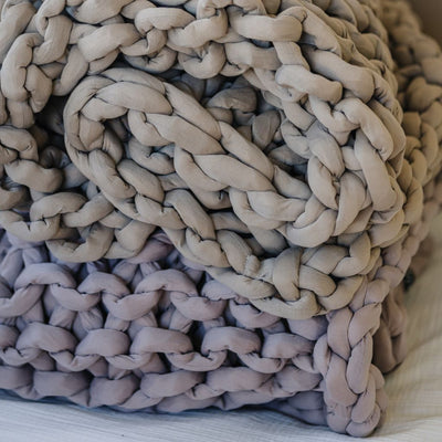 Nuzzie knit weighted blanket in Dusty Rose, close-up showing the soft feel