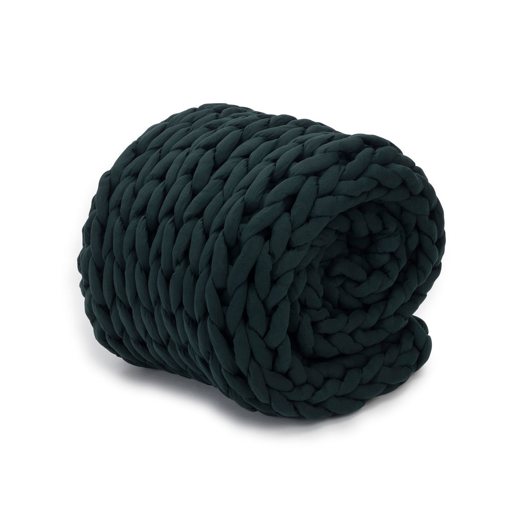 Nuzzie knit weighted blanket in Forest Green, rolled up