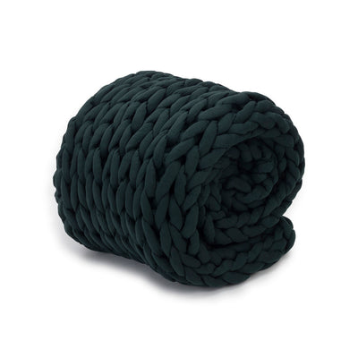Nuzzie knit weighted blanket in Forest Green, rolled up