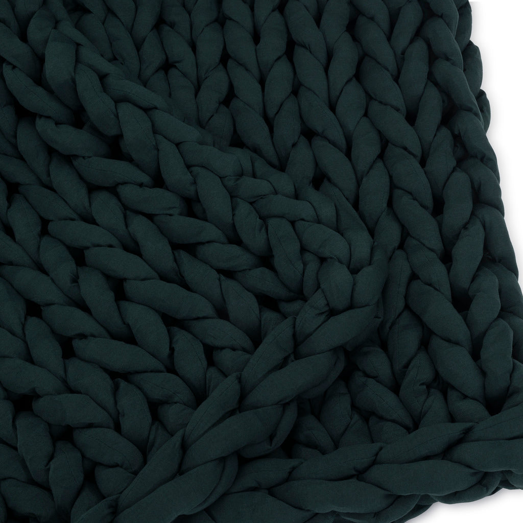 Nuzzie knit weighted blanket in Forest Green, close-up showing the soft knit