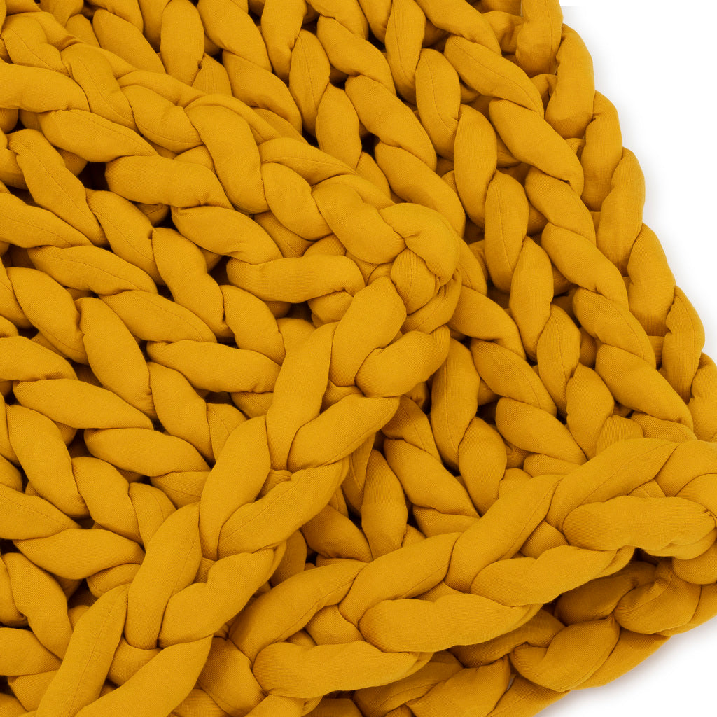 Nuzzie knit weighted blanket in Marigold, close-up of the knit texture
