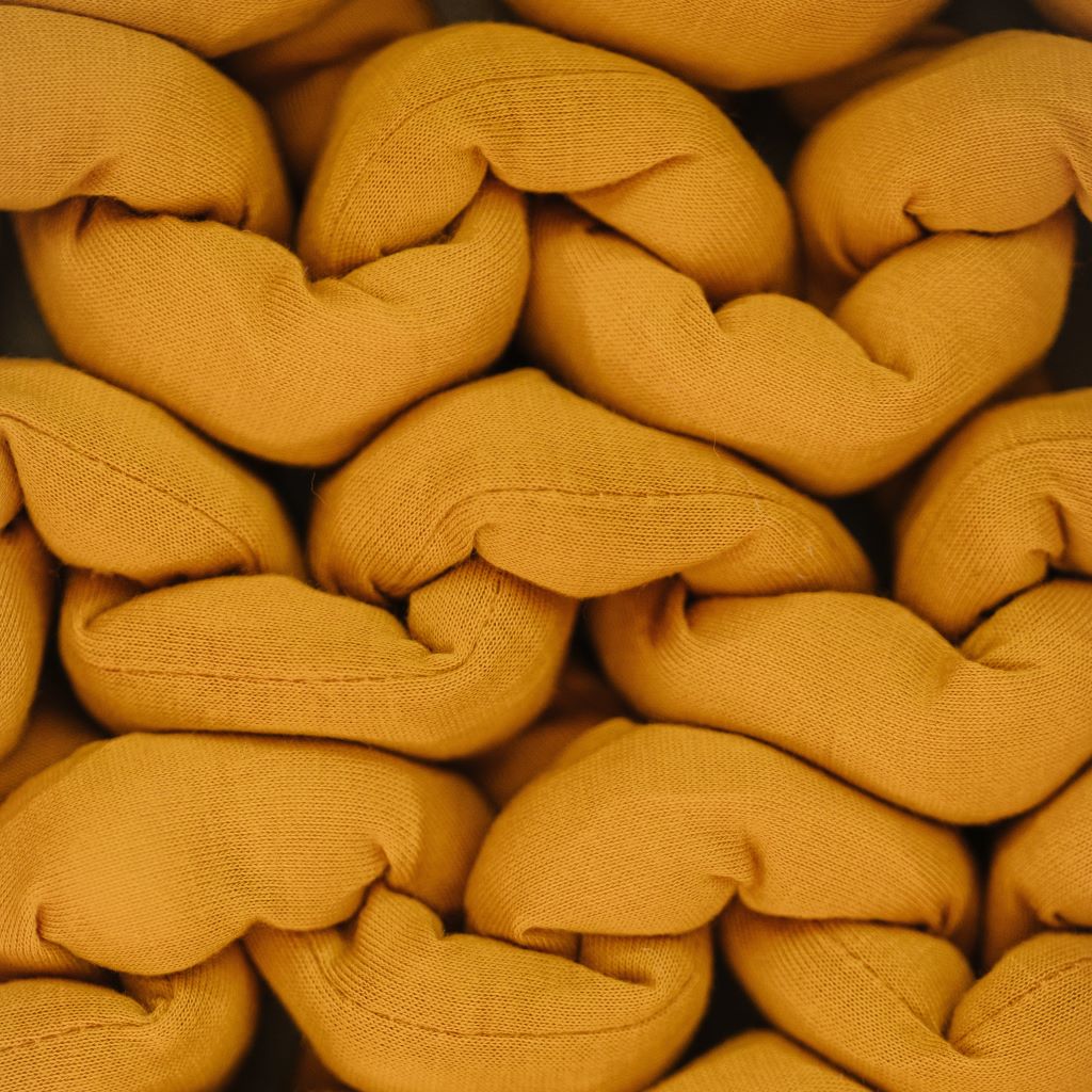 Nuzzie knit weighted blanket in Marigold, close-up of the fabric