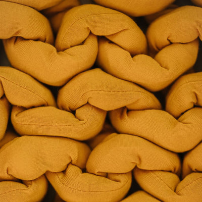Nuzzie knit weighted blanket in Marigold, close-up of the fabric