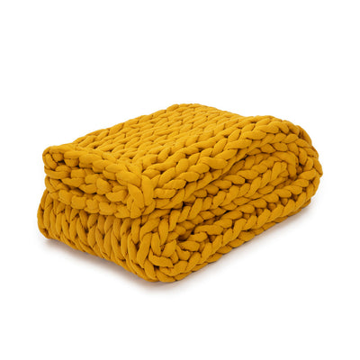 Nuzzie knit weighted blanket in Marigold, folded
