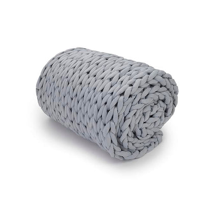 Nuzzie knit weighted blanket in Misty Grey, rolled up