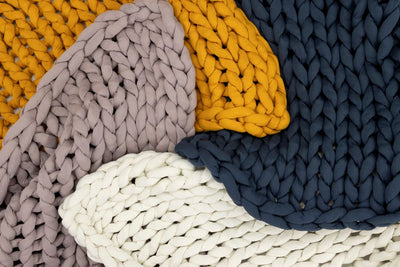 Nuzzie knit weighted blanket, rolled up