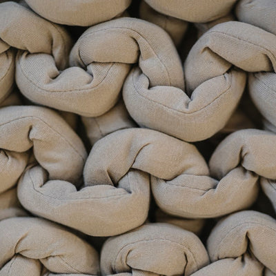 Nuzzie knit weighted blanket in Taupe, close-up of the knit texture