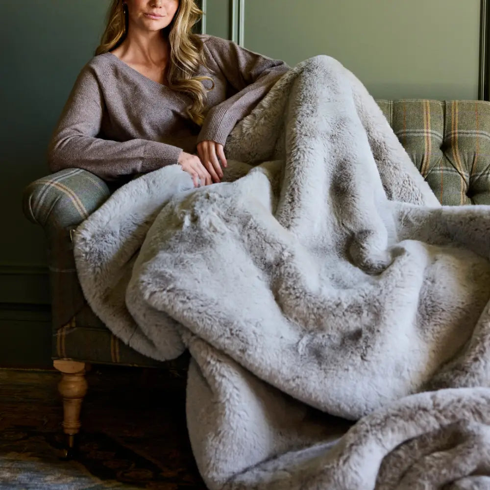 Nuzzie Snuggle Luxe Blanket - Earl Grey Soft on Couch