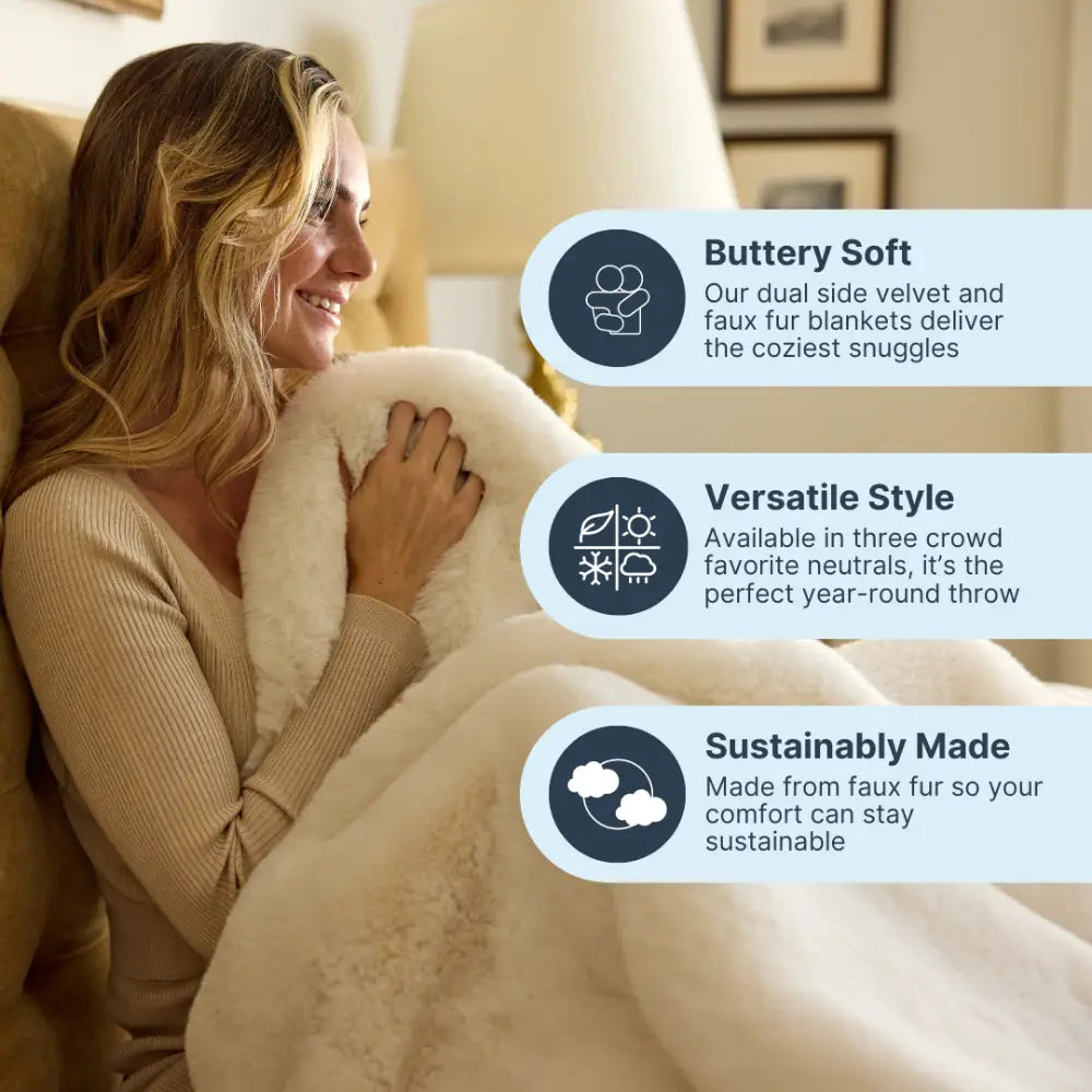 Nuzzie Snuggle Luxe vanilla chunky blanket draped over living room sofa
