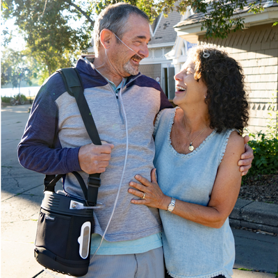 O2 Concepts Oxlife Liberty 2 - Portable Oxygen Concentrator - Couple Outside