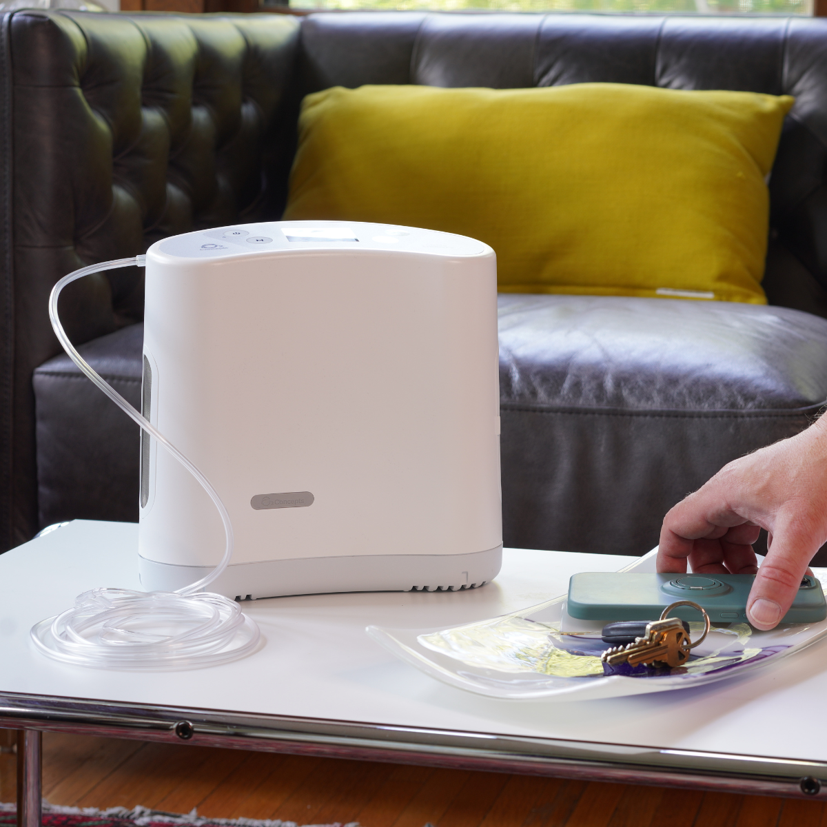 O2 Concepts Oxlife Liberty 2 - Portable Oxygen Concentrator on Table