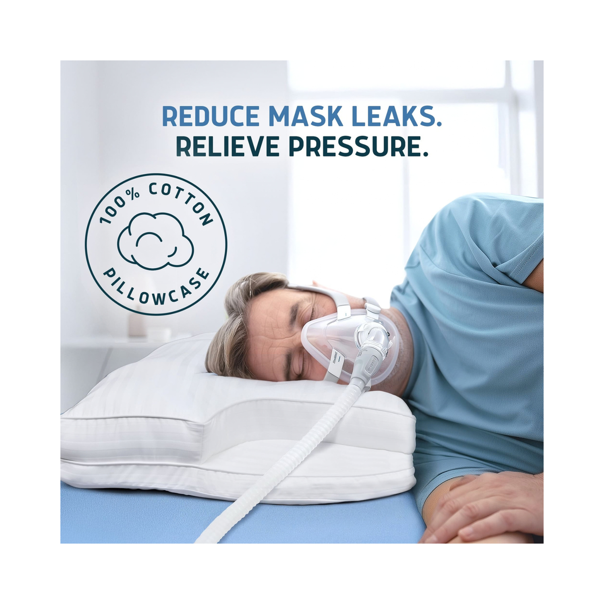 A person lying on a bed wearing a clear CPAP mask and breathing tube, resting on a white contoured pillow. Blue text at the top reads 'REDUCE MASK LEAKS.