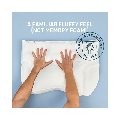 Top-down view of a white contoured pillow with a person's hands pressing down on it, set against a light blue background with text reading 'A FAMILIAR FLUFFY FEEL (NOT MEMORY FOAM!)' and a circular 'DOWN-ALTERNATIVE FILLING' badge.