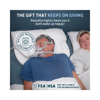 A square promotional graphic for a pillowcase. The top portion contains marketing text on a dark blue background, while the bottom shows a lifestyle photo of two people sleeping peacefully in bed, with one wearing a machine washable pillowcase.