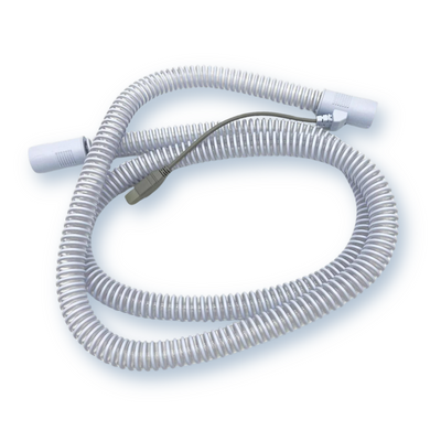 Full view of React Health Luna G3 heated CPAP tubing laid flat with machine connector