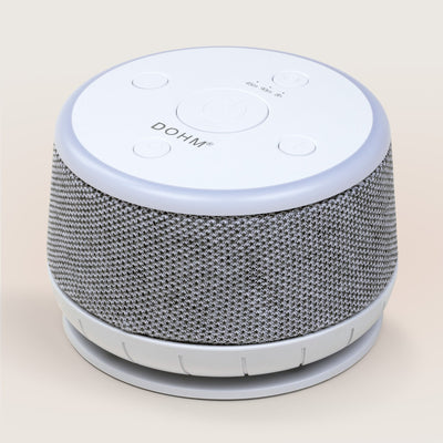 Side profile of Yogasleep Dohm Nova sound machine highlighting dual speed acoustic housing